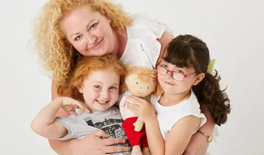 A young cancer patient supported by CLIC Sargent - with her Mum and sister