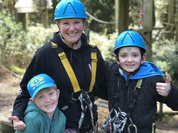 Oliver (right), his brother Ben and mum Nicky taking part in a woodland adventure course