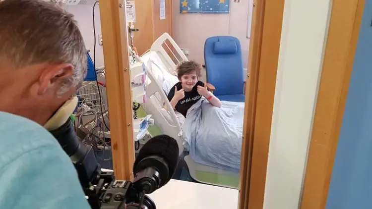 Oliver being filmed while having cancer treatment in isolation in hospital