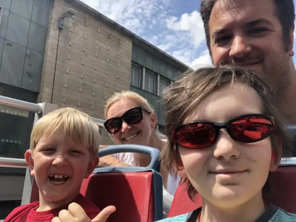 Oliver and his family on a sight-seeing bus trip