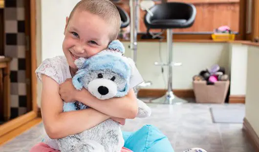 Amelia with Barnaby the CLIC Sargent bear