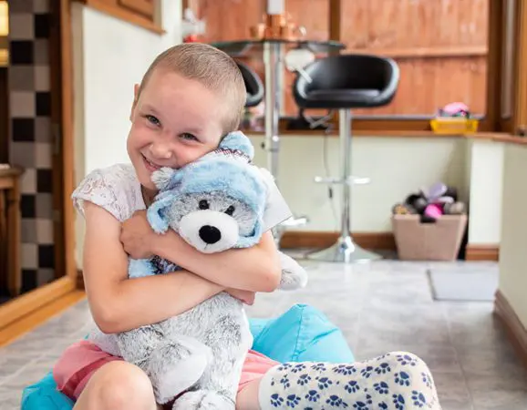 Amelia with Barnaby the CLIC Sargent bear