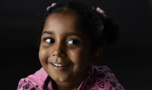 Child with a cheeky smile