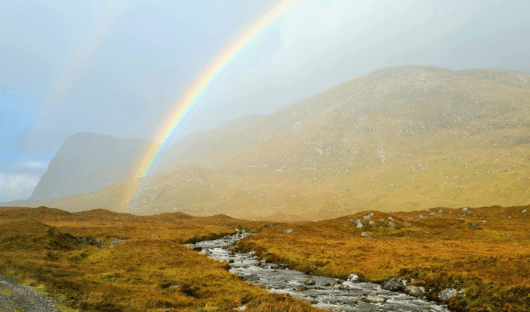 A rainbow over the Highlands in Scotland