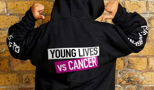 Black hoodie with Young Lives vs Cancer on reverse