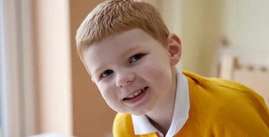 Smiling child looking into camera