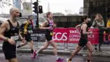 Young Lives vs Cancer London Marathon runner runs through the street
