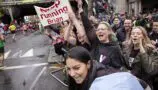 The crowd cheers for Young Lives vs Cancer London Marathon runners