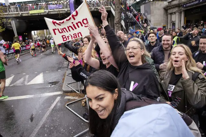 The crowd cheers for Young Lives vs Cancer London Marathon runners