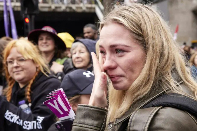 Woman in the London Marathon crowd is emotional