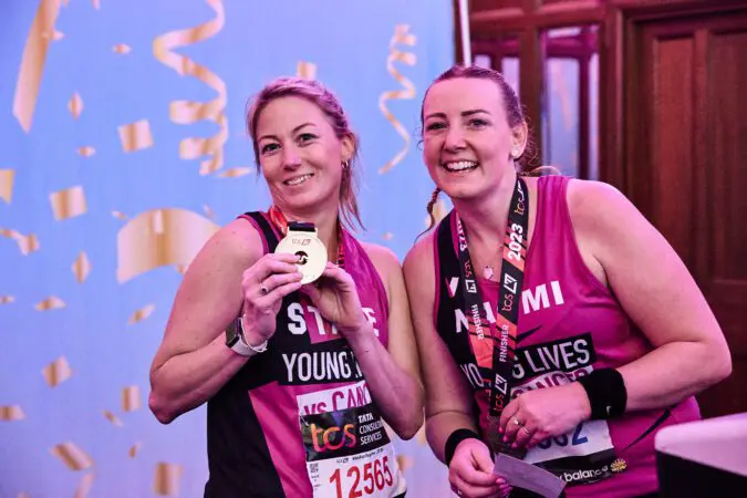 Young Lives vs Cancer London Marathon runners with their medals