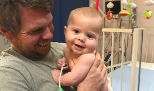 Baby Oscar in the hospital with his dad Russell