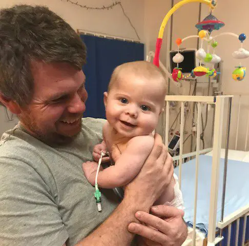 Baby Oscar in the hospital with his dad Russell