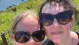 Louise and her friend on a sunny day by the sea