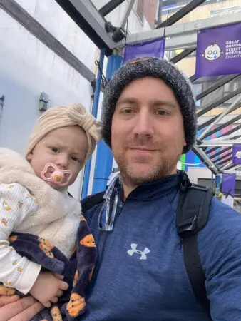 Orla with her dad Adam, together they are looking at the camera.