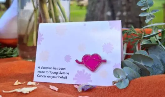 Young Lives vs Cancer pin badge used as a wedding favour