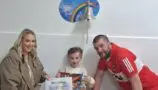 Daithi with his parents in hospital