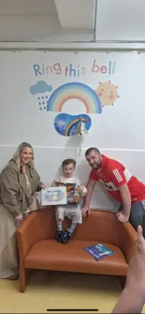 Daithi with his parents in hospital
