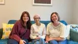 A photographer of Cheryl, the Accommodation Manager at Jack’s House, alongside Olivia and her mum Karen, who were staying in the Home and filmed as part of the programme