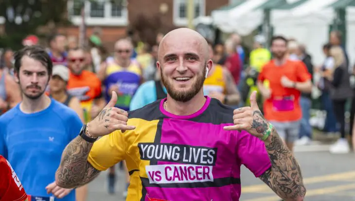 Runner taking part in an event wearing a Young Lives Vs Cancer vest