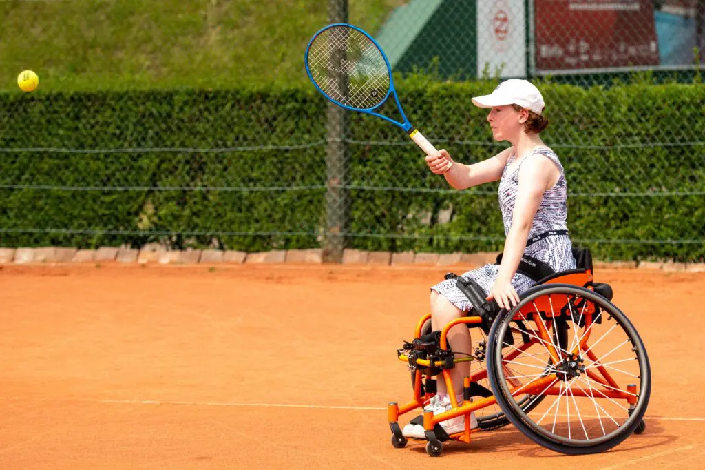 Lucy playing wheelchair tennis