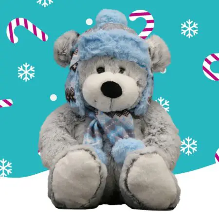 A grey bear with a blue hat and scarf