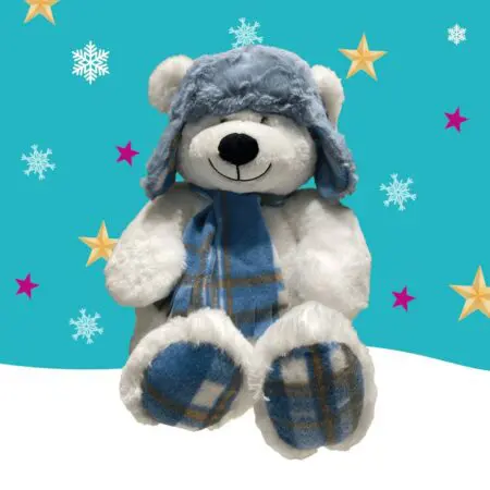 A white bear wearing a grey hat and blue scarf