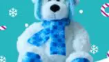 A white and blue bear wearing a blue scarf and hat