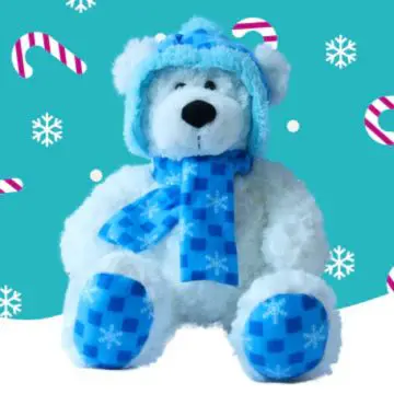 A white and blue bear wearing a blue scarf and hat