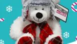 A white bear with a grey hat and red tartan scarf