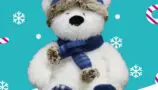 A white bear wearing a navy blue scarf and hat