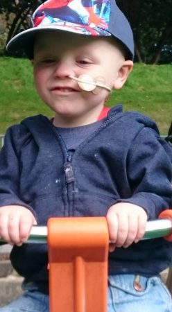 Lucien playing at a park during his cancer treatment