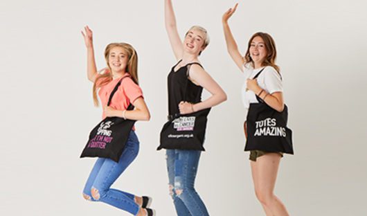 Molly, her sister and friend modelling CLIC Sargent tote bags
