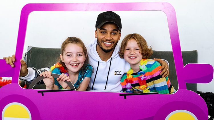 Singer Aston Merrygold met Ellie-Mae and Maisie, two children supported by CLIC Sargent, as part of Childhood Cancer Awareness Month