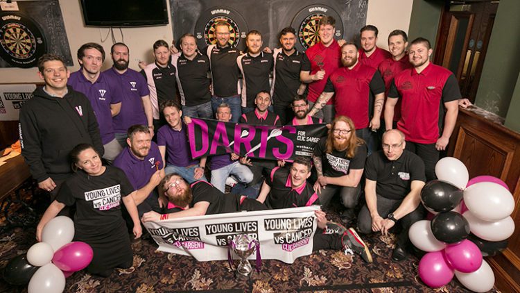 Pub teams from J D Wetherspoon taking part in a darts tournament for CLIC Sargent