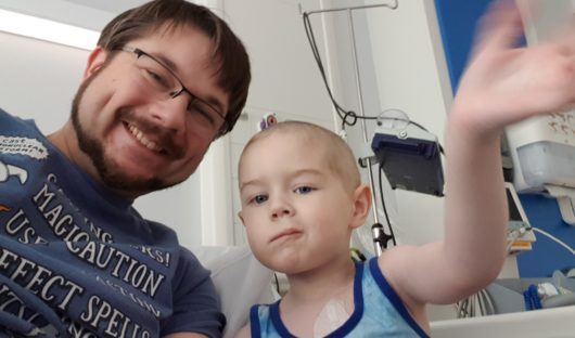 Alistair and his son Gideon during treatment