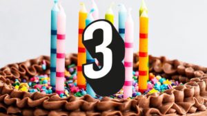 Cake and candles with number 3