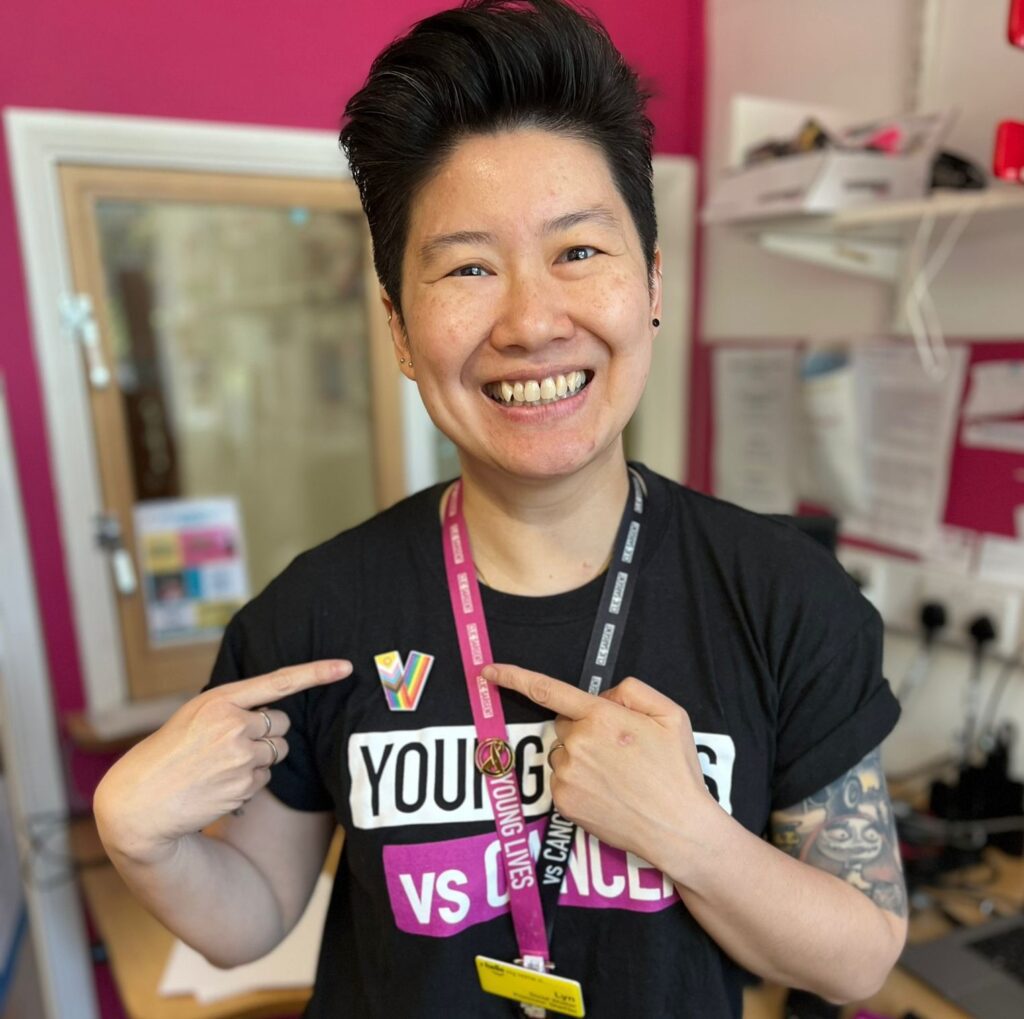 Young Lives vs Cancer Social Worker, Lyn, wears her new Pride badge
